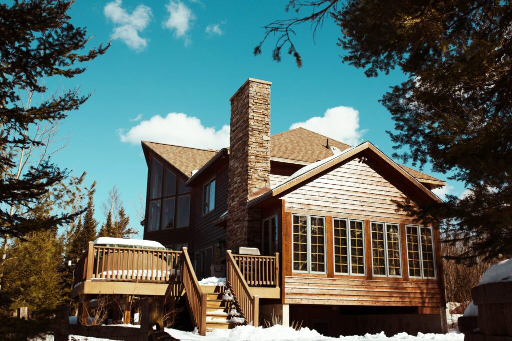 Brown house surrounded by trees