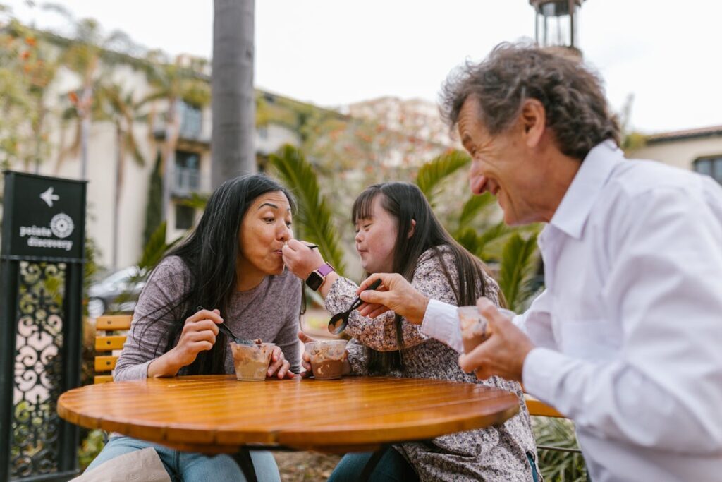 A Happy Family Eating Ice Cream in a Store at San Diego