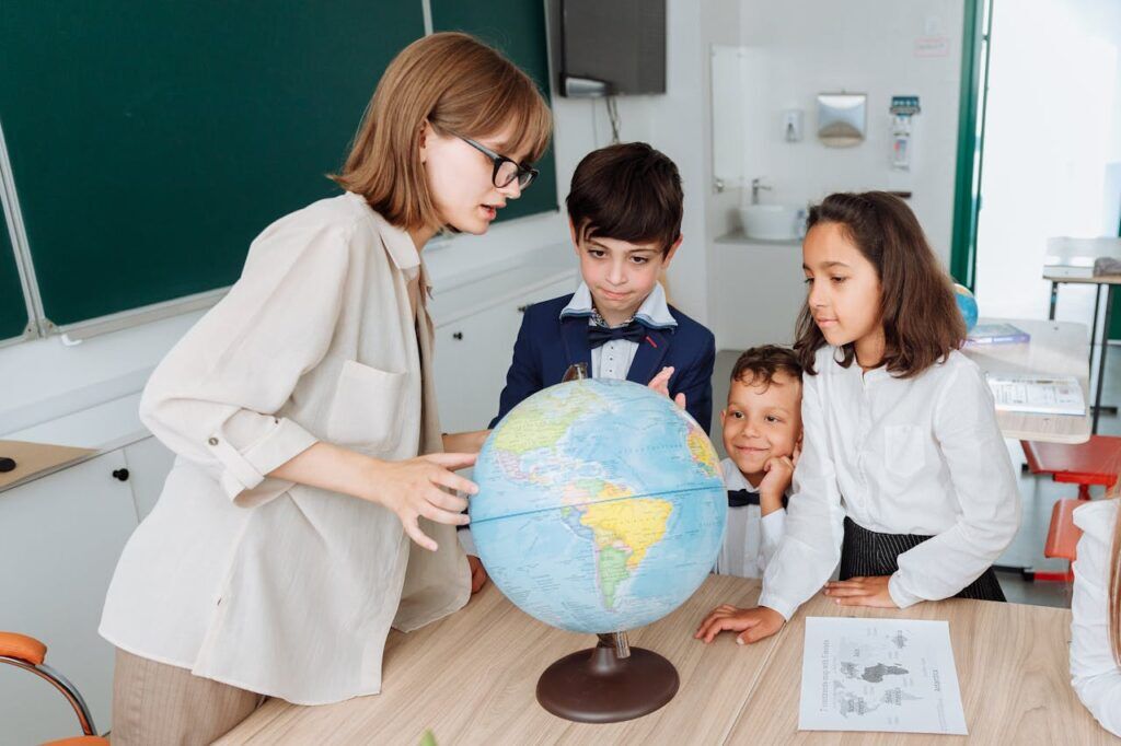 A Teacher Discussing Something with Her Students