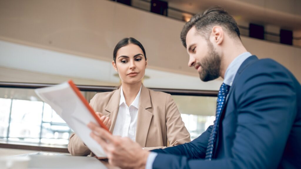 A Realtor and Client Going Over Some Paperwork