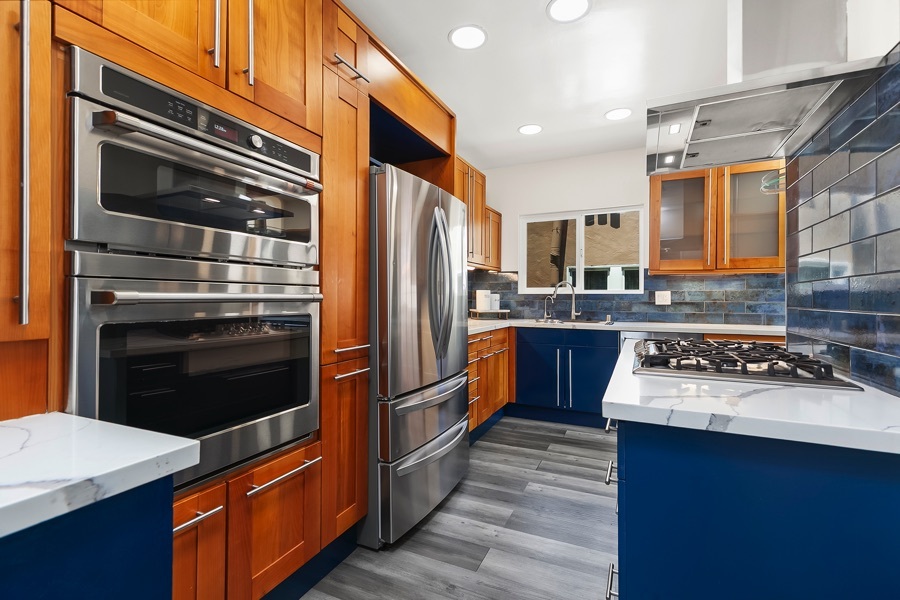 2619 Montclair St - Kitchen Area with a Stove, Built-in Wood Cabinets, Oven, and Refrigerator
