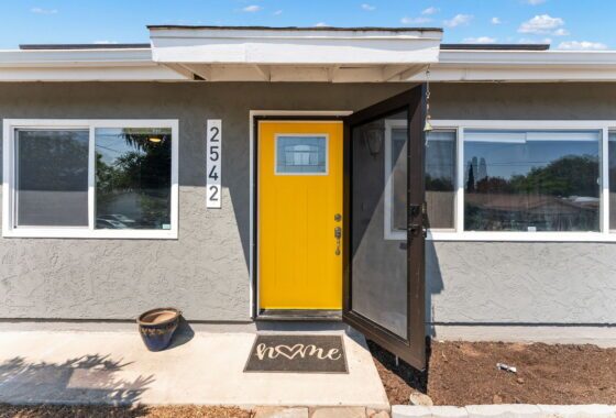 Home in lemon grove with bright yellow door