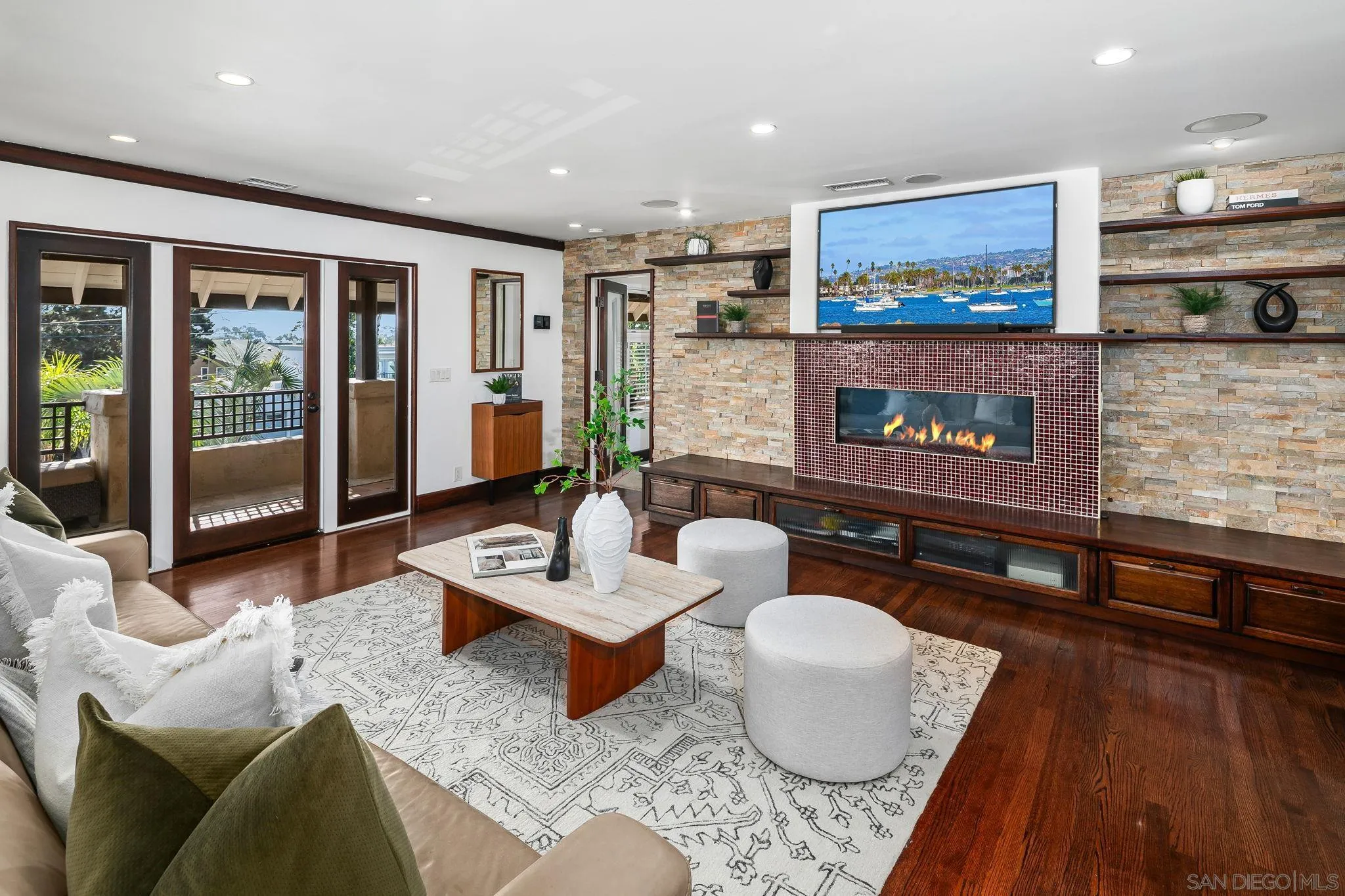 Freshly painted and staged to perfection. Come see this beautifully remodeled masterpiece in sought after North Mission Hills. Enter the front courtyard with its zen like fountain....Imagine stepping into your favorite tropical resort every day. Light and bright with soaring ceilings, gleaming wood floors, this home exudes elegance and refinement at every turn. From the upscale bathrooms, to the two remodeled kitchens (one on each level). This home was built to entertain large groups to intimate gatherings with finesse. The beautiful spa escape pool and surrounding patio area has everything you need to fully enjoy southern California living year round. Flexible floor plan features 3 primary suites (one is downstairs, two on upper level), 2 additional bedrooms and an optional office space. Huge living room and formal dining room on first level, expansive family room with wet bar upstairs. Did I mention the upstairs open air kitchen? Perfect for morning coffee or evening meal...Fully owned solar means low/no electricity bills. Prepare to be wowed....